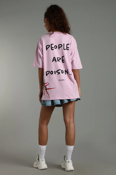back profile of a woman wearing a pink oversized P.A.P. centipede unisex oversized t-shirt 