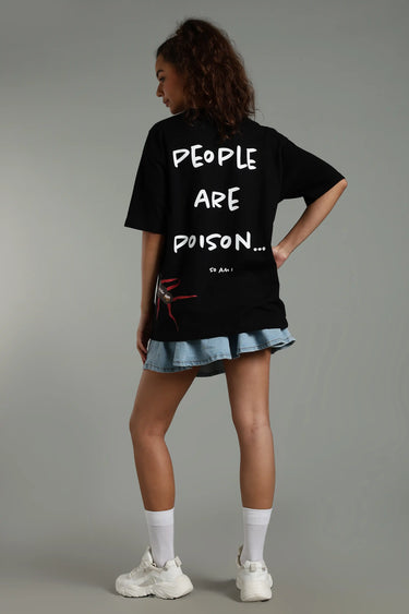 back view of a woman wearing the black centipede oversized t-shirt