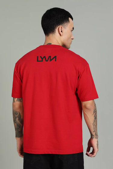 A man wearing a red t-shirt with the 'LYVN' logo on the back against a gray background