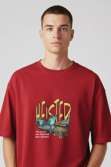 Red oversized graphic t-shirt with bold yellow "Heisted" text and vintage car illustration on front.