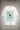White oversized graphic t-shirt with blue vertical stripes and green mailbox graphic, Just Checking text design.