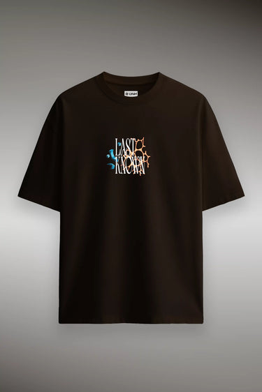 Black oversized graphic t-shirt with colorful abstract text design on chest, short sleeves.