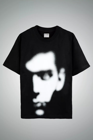 Unisex Oversized Black t-shirt with a white graphic of an abstract face on a gray background